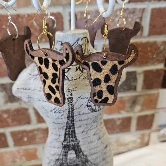 Rockin'Hot originals Jewelry - Rockin' Hot Originals Steer(cow) cheetah earrings laid in dark wood